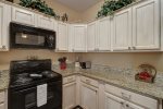 Large kitchen counter space, oven & range, and microwave